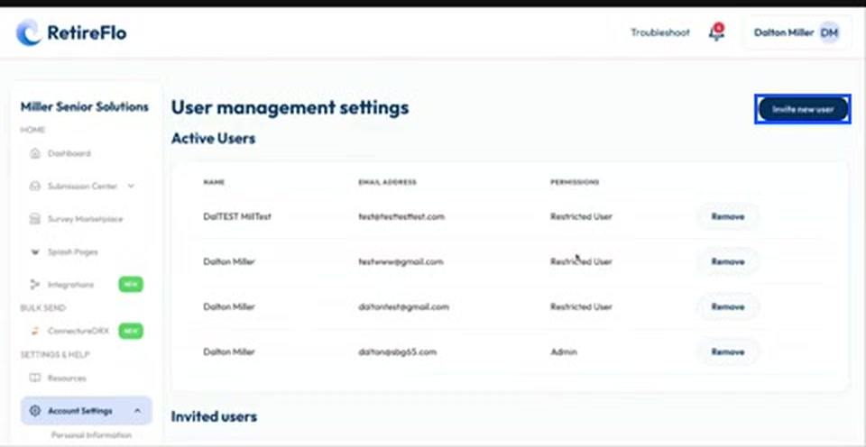 The User management settings page with the Invite new user button highlighted