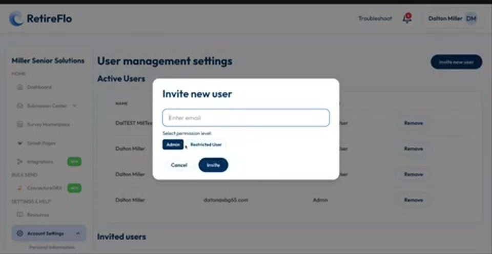 The Invite new user pop-up with an email field and Admin or Restricted User permission levels